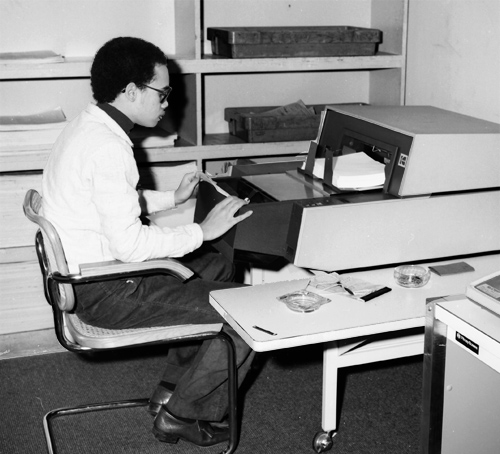 FEC staff scanning compliance forms, 1982