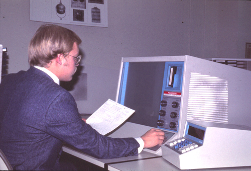 FEC staff at microfilm reader, 1979